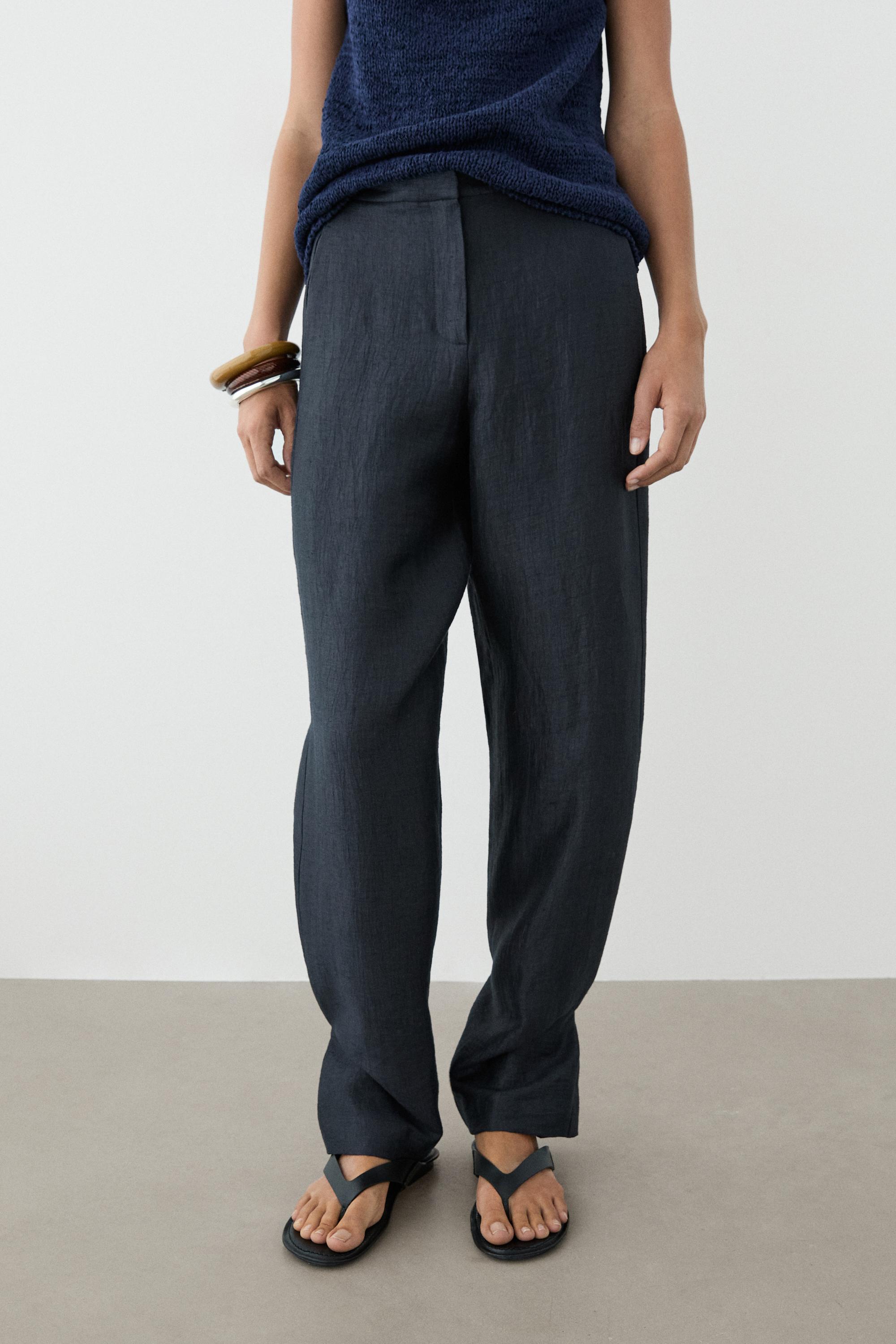Trousers with gathered hems